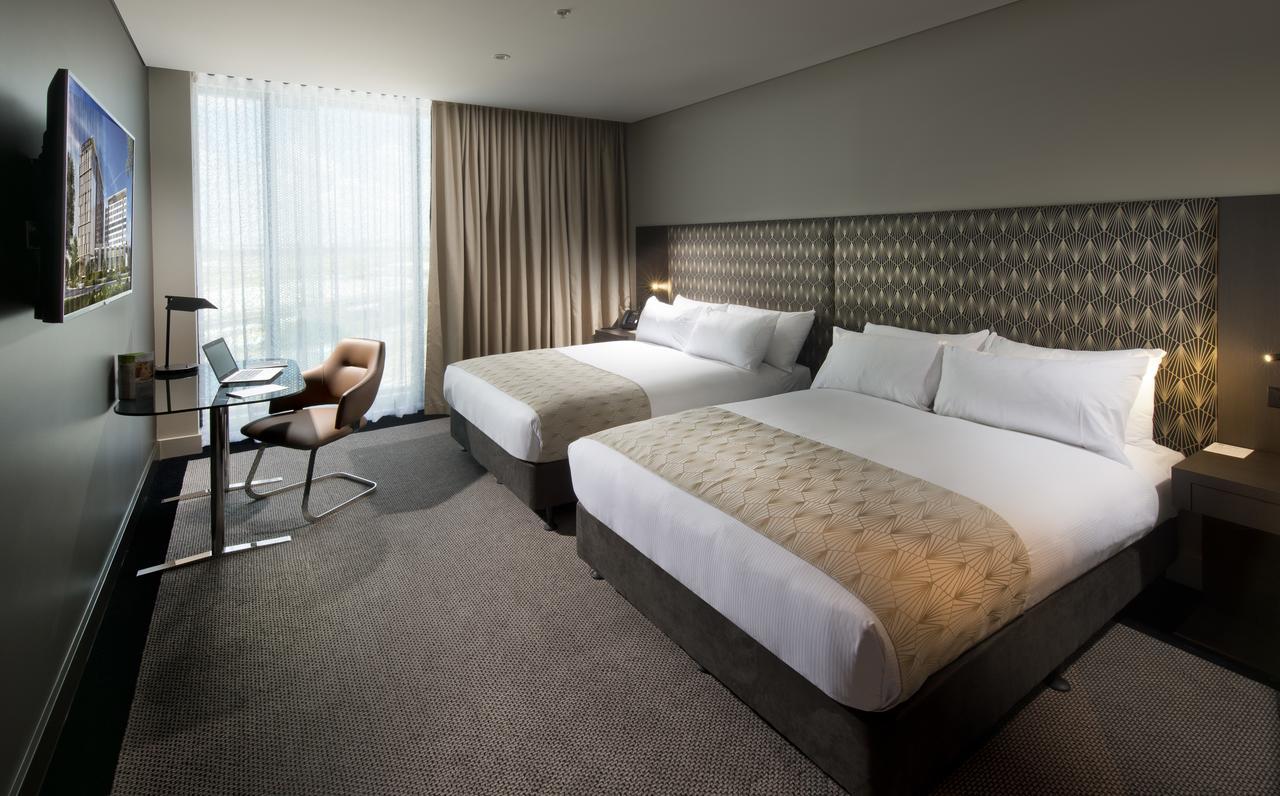 Pullman Brisbane Airport Hotel Bagian luar foto A room at the hotel